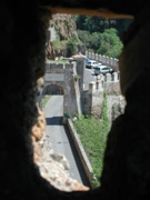 Ceri. Arco di ingresso visto da una feritoia della merlatura del castello